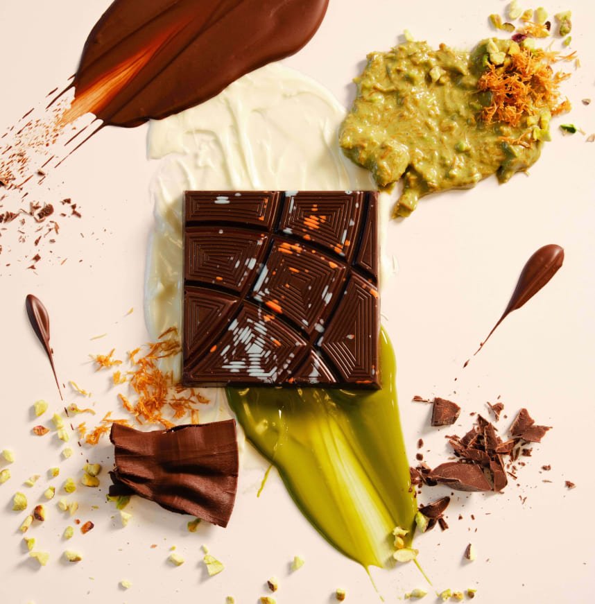 Ingredient board featuring crispy shredded kataifi, rich pistachio cream, and premium chocolate coating used in Dubai Chocolate by Chef Nouel.