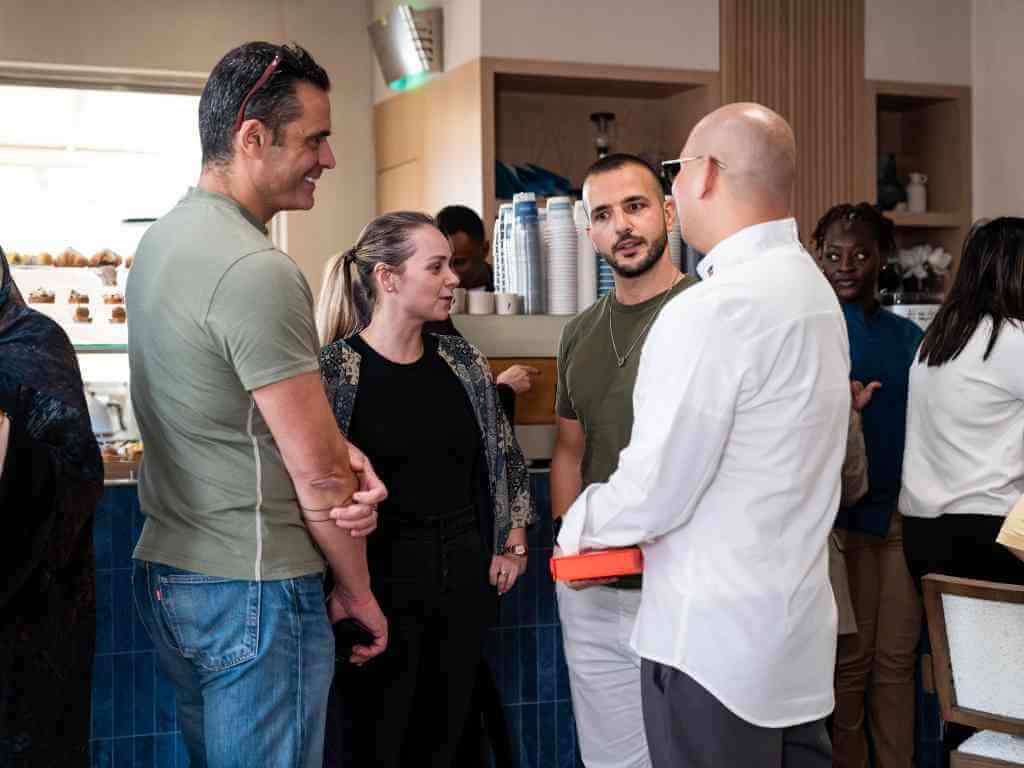 Chef Nouel speaking and connecting with guests.