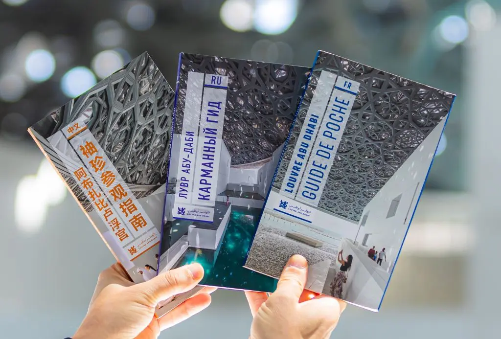 Louvre Abu Dhabi guidebooks in multiple languages, photographed by Sandbox Creatives — content creation agency Abu Dhabi